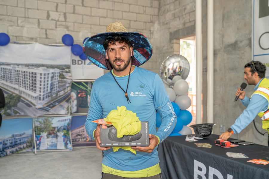 A tradesman with the prize he won at a BDI Construction crew appreciation event