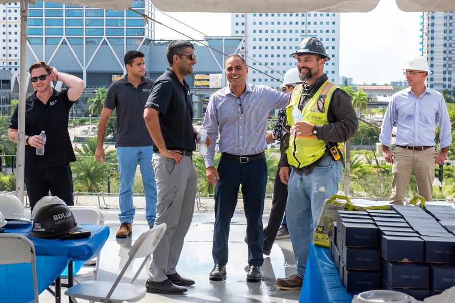 The BDI Construction team and guests at a topping out celebration above the city